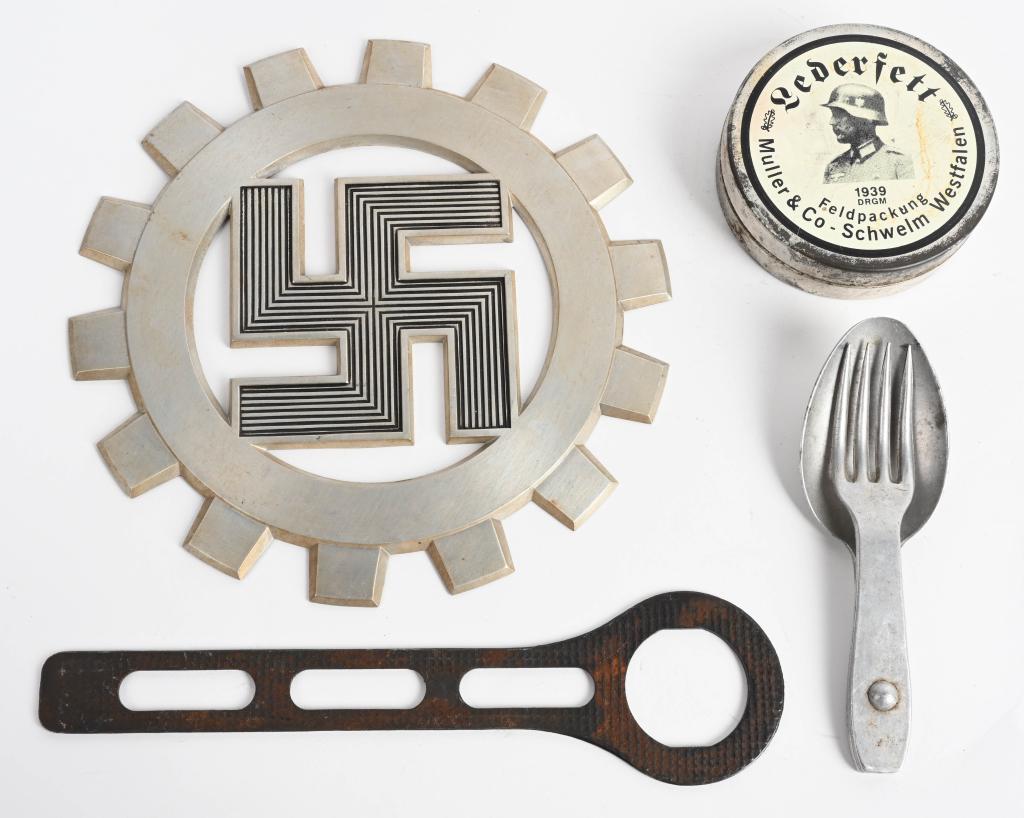 WWII NAZI DAF INSIGNIA GRENADE WRENCH SHOE POLISH: WWII Nazi German insignia to include 1) DAF WALL PLAQUE. A cast aluminum plaque in the form of the DAF emblem; being a cut-out, mobile swastika within a fourteen-toothed cog, 20cm in diameter. 2) FIEL