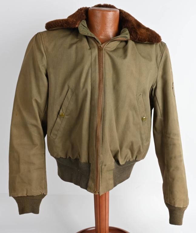 WWII US ARMY AIR CORPS B-15 FLIGHT JACKET N MINT: Near mint, Olive color cotton fabric type B-15A jacket with fur collar and fur-lined, front "CONMAR" zip fastener with leather pull tab. Two slant side pockets with press button closure, left sleeve p