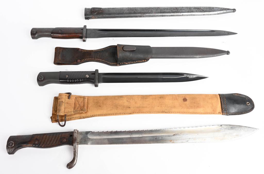 WW1 & WWII BAYONET LOT OF 3 GERMAN & YUGOSLAVIAN: Lot of three bayonets to include 1) WW1 IMPERIAL GERMAN SAWTOOTH SHORT BAYONET. 14 7/8" overall. Wood grip plates are excellent. Missing the correct scabbard but does have a M1903 bayonet outer cover.