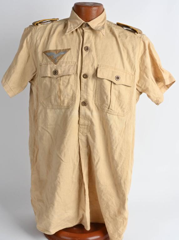 WWII NAZI GERMAN TROPICAL LUFTWAFFE SHORT SL SHIRT: Tropical Luftwaffe short sleeved shirt. Machine sewn breast eagle with correct flight shoulder boards. Excellent