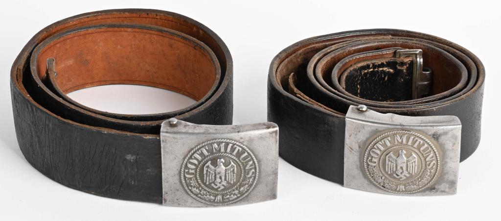 WWII NAZI GERMAN HEER BELT & BUCKLE LOT OF 2 WW2: Lot of two belt and belt buckle lot to include 1) 1940 pattern stamped steel construction, combat box buckle features a smooth outer field with a high relief, embossed Wehrmacht eagle with down swept 