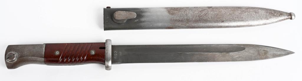 WWII NAZI GERMAN K98 COMBAT BAYONET MATCHING WW2: Roughly 25cm long, drop forged, steel construction blade with wide fullers. Blade retains about most of it's original phosphate finish. Maker marked SGX44 E.& F. Hoerster, Solingen. Scabbard serial nu
