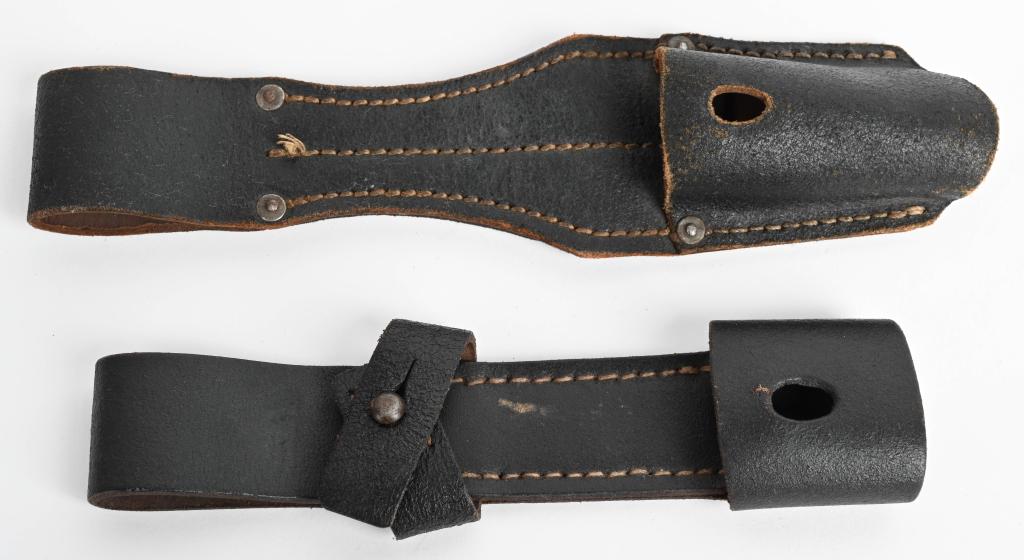 WWII NAZI GERMAN K98 BAYONET FROG KNOT LOT OF 2: Smooth blackened leather construction bayonet frog with a horizontal retaining strap. Shows wear and use but still in good strong condition. Rbnr# marked. Excellent 2) Smooth blackened leather constru
