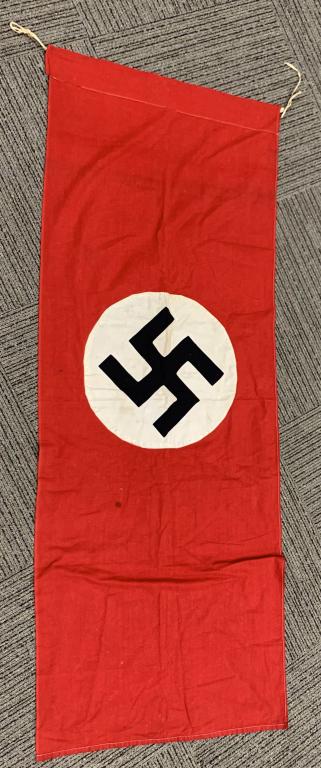 WWII NAZI GERMAN NSDAP WALL BANNER WW2: Multi-piece cotton construction banner approximately 28 x 76 inches. To both its red fields are sewn are white disks, with separately sewn on mobile swastikas in black. Shows the expected light period