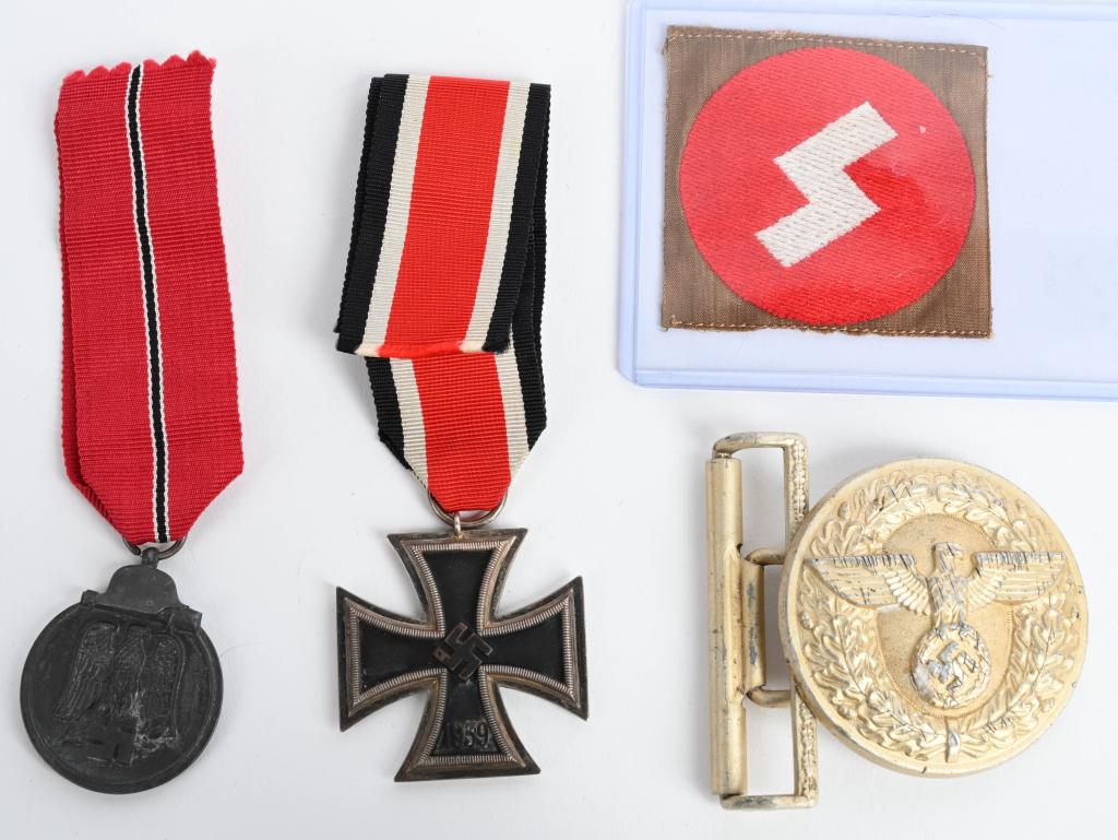 WWII NAZI GERMAN NSDAP BELT BUCKLE MEDAL LOT EKII: WWII Nazi German insignia lot to include 1) German World War II Deutsches Youth DJ Runic Shoulder Sleeve Patch. Measures 2 1/4” wide by 2 5/16” tall. The front shows a single white runic in the ce