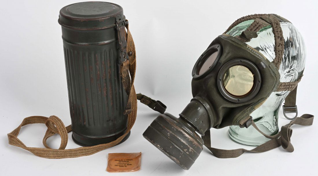 WWII NAZI GERMAN HEER M30 GASMASK & CANISTER WW2: M30 pattern cloth covered, rubberized canvas gas mask. Mask is complete with all straps. Mask is size marked 2. Included is an FE37 filter. The mask comes housed in a second pattern M30/38 corrugated
