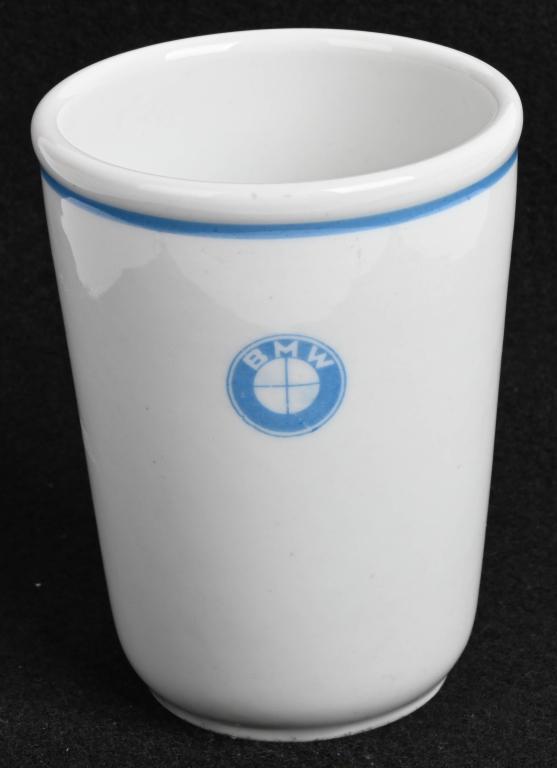WWII NAZI GERMAN BMW FACTORY COFFEE CUP WW2: WWII Nazi German BMW coffee cup measuring 4 1/2 inches tall having the BMW crest to the front. On the bottom of the mug is the DAF insignia and is also maker marked to Rosenthal. “Under the National