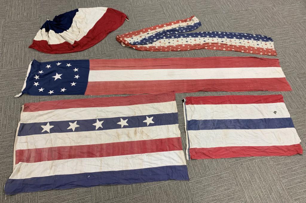 WWII US 5pc LOT AMERICAN PATRIOTIC BUNTING FLAGS: Five large World War II era US Red, White, and Blue flags. Includes a large blue stars & stripes banner measuring approximately 14' long and 30" wide; a Red, White, and Blue stars banner measuring app