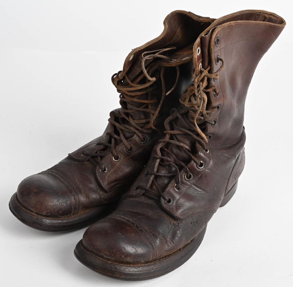 WWII US ARMY AIRBORNE COMBAT BOOTS SIZE 9 NAMED: Pair of brown leather boots with leather laces, 12-eyelet, with capped toes and reinforced heels. Two-piece solid rubber soles with "US ARMY" on the toes. This style of boot was first introduced durin