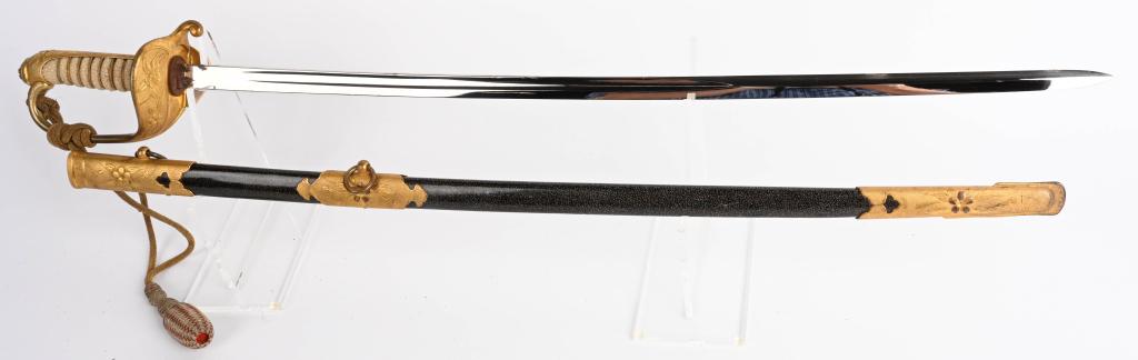 WWII JAPANESE NAVY OFFICER SWORD & SCABBARD WW2: WWII Japanese navy Sword, 25 1/2" single fullered bright blade, original washer, perfect shark skin grip with double wire brass wrap, brass guard retains original gold wash, with folding langet. Brass