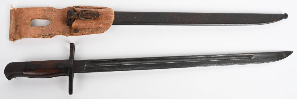 WWII JAPANESE TYPE 30 BAYONET W/ SHRAPNEL DAMAGE: WWII Japanese Type 30 bayonet having a straight guard, rounded bird head pommel, contoured wood grips and a blue finish blade with the proof of Howa Jyuko under Nagoya supervision manufacture. The bla