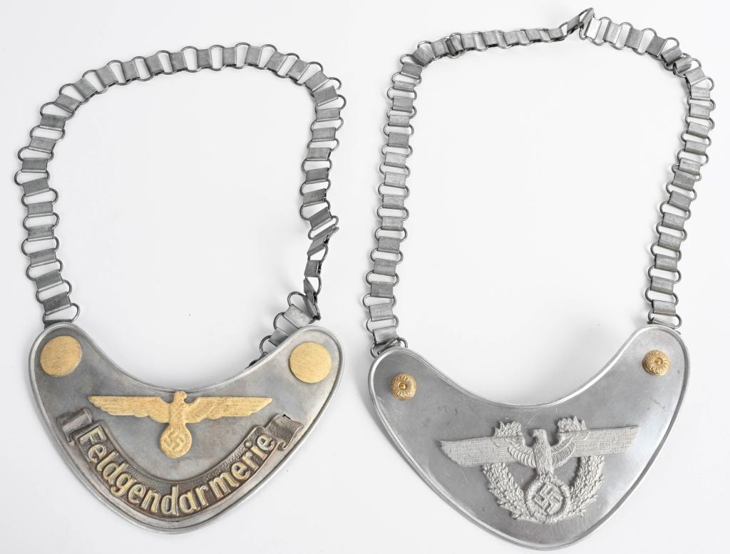 REPRO LOT OF 2 NAZI GERMAN POLICE GORGET: Lot of two reproduction police gorgets to include 1) Police Gorget is approx. 4" tall by 6.5" wide. One of the clips on the reverse side is maker marked A for Assmann. Has a grey wool backing. Steel c