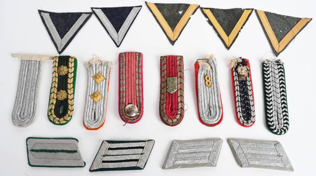 WWII NAZI GERMAN INSIGNIA LOT COLLAR TABS SHOULDER: WWII Nazi German insignia to include 8 single officers shoulder boards, 4 collar tabs and 5 Gefreiter rank chevrons some with moth damage
