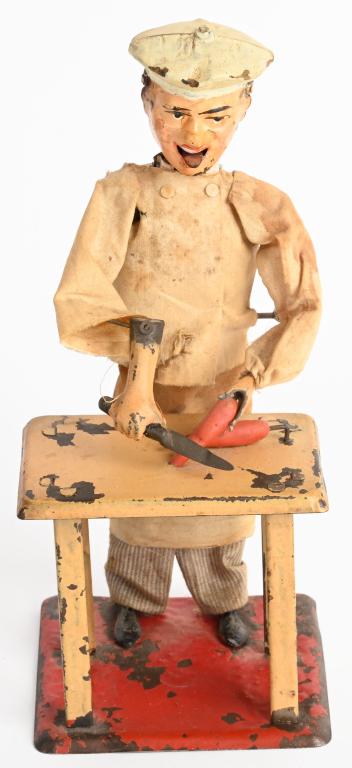 FERNAND MARTIN TIN WINDUP LITTLE COOK: Scarce Fernand Martin windup Little Cook. All original and complete. Windup needs repair. A hard to find toy. 8" Very Good-Excellent