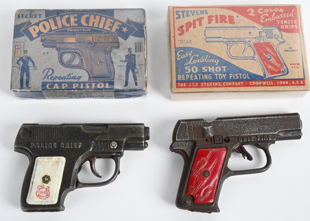 POLICE CHIEF & SPIT FIRE CAP PISTOLS w/ BOX: Nice pair of Kenton and JE Stevens cast iron Cap Guns. Both original and look never played with. Largest 5 1/2" Boxed