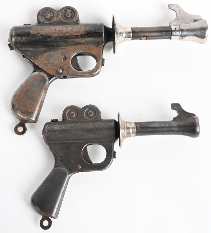 2- VINTAGE DAISY BUCK ROGERS XZ-35 PISTOLS: Nice pair of original pistols. Lot includes the small Wilma Deering pistol, along with the regular size pistol. Both cock with the handles and worked when tested. Largest is 10". Good-Very Good