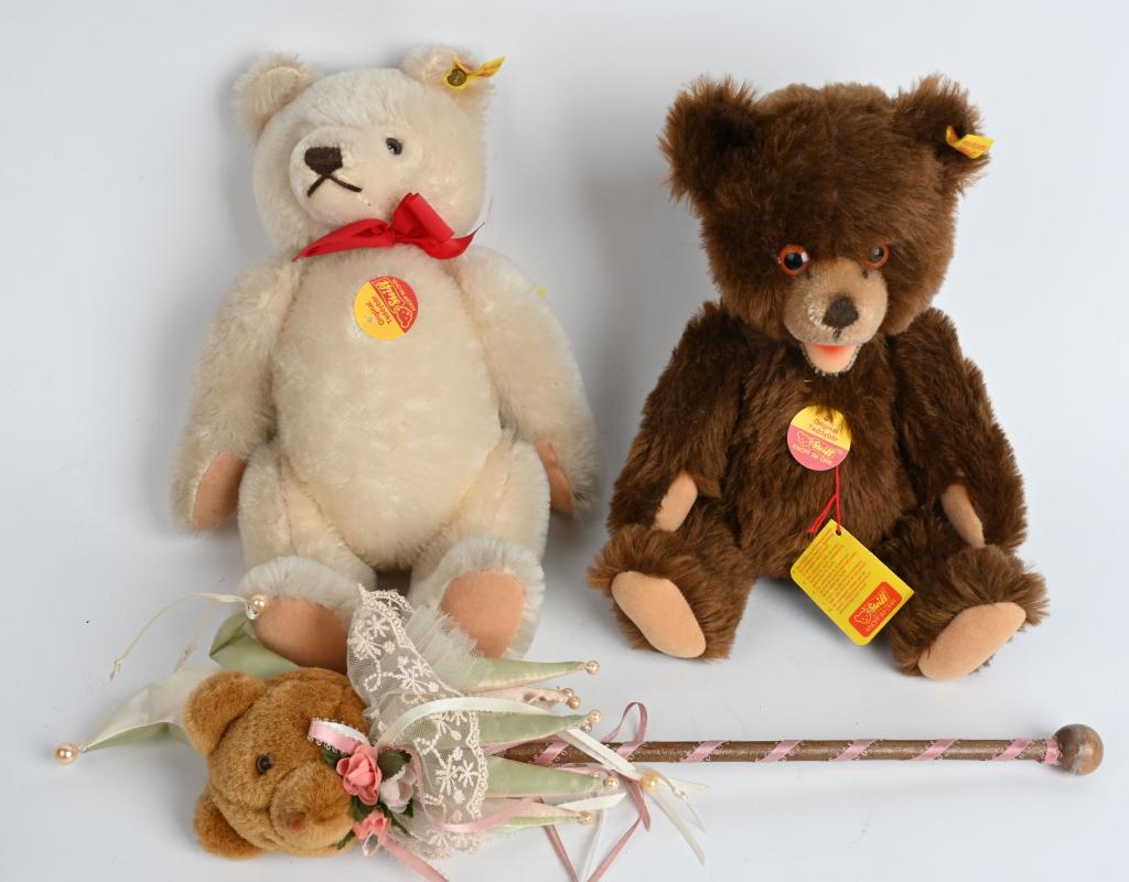 LOT (3) DISARMING LOVEABLE TEDDY BEARS - STEIFF: The first Steiff has his original ear tag, ribbon, hang tag and cardboard pennant. Unlike a traditional turn of the century bear, this one has a more whimsical appeal with soft brown fur, laughing mou
