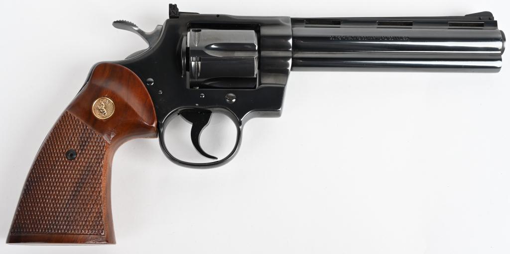 COLT PYTHON 6" DOUBLE ACTION REVOLVER: SERIAL K39159. BARREL 6". CALIBER .357 MAGNUM. MADE IN 1981 The classic 6" Python that features a full vent rib, full barrel lug, blue finish, target rear sight, wide hammer & grooved trigger with str