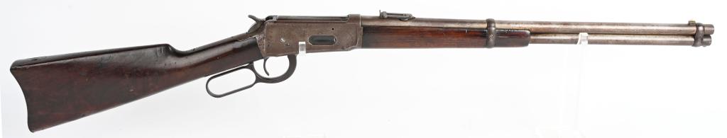 WINCHESTER MODEL 1894 SADDLE RING CARBINE 38-55: SERIAL NUMBER 62468 BARREL 20" CALIBER 38-55 WCF MANUFACTUR 1899 . Blue finish with post front sight and ladder adjustable rear sight. factory fitted with saddle ring and stud. Walnut stocks with fore