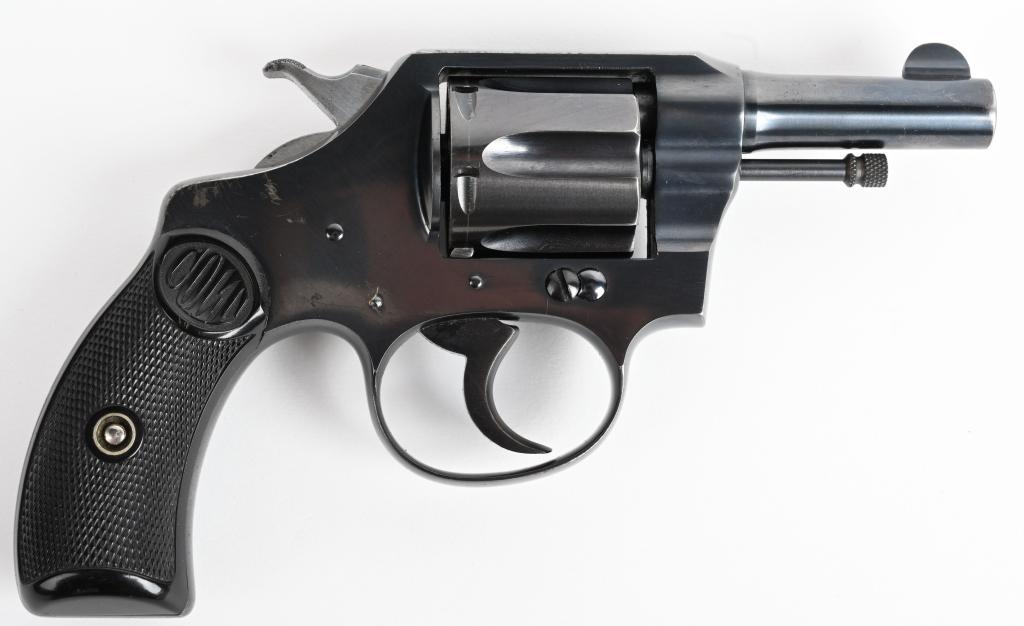HIGH CONDITION COLT POCKET POSITIVE REVOLVER: SERIAL 114123. BARREL 2 1/4". CALIBER .32 POLICE. MADE IN 1923. Desireable short barrel, six shot, fluted cylinder with Colt gutta percha grips. Back strap has most blue. and some light high edge wear