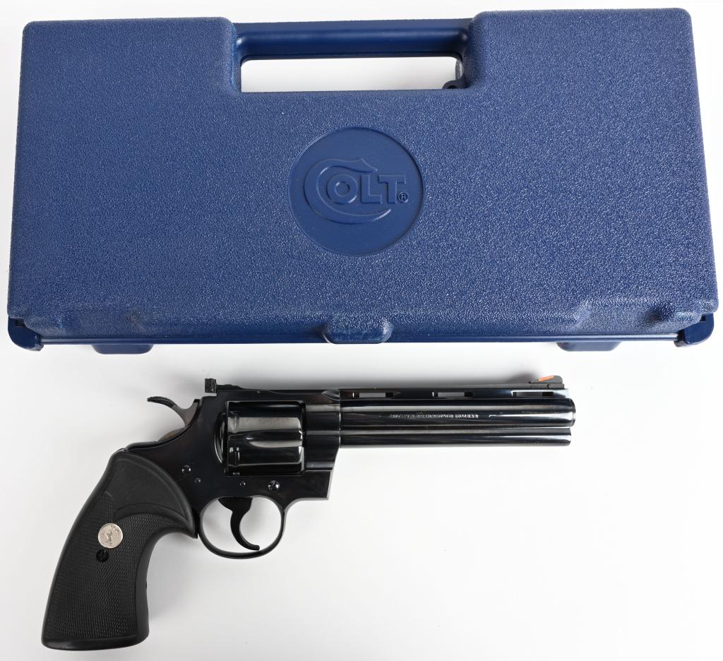 BOXED COLT PYTHON 6" BLUE REVOLVER: SERIAL T94615. BARREL 6". CALIBER .357 MAGNUM. MADE IN 1985-87. Classic blued Python features vent rib, red front sight insert, target rear sight, wide hammer spur, grooved trigger, six shot, fluted c