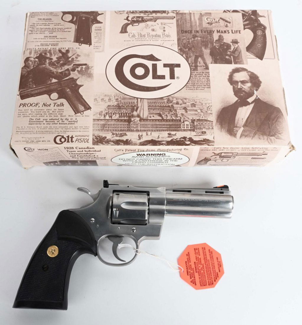 MIB STS COLT PYTHON 4" REVOLVER: SERIAL KT4589. BARREL 4" CALIBER .357 MAGNUM. MADE 1992-1996. Never fired with only typical light drag line, this late Python features full vent rib, solid lug, red insert front sight, target rear sig
