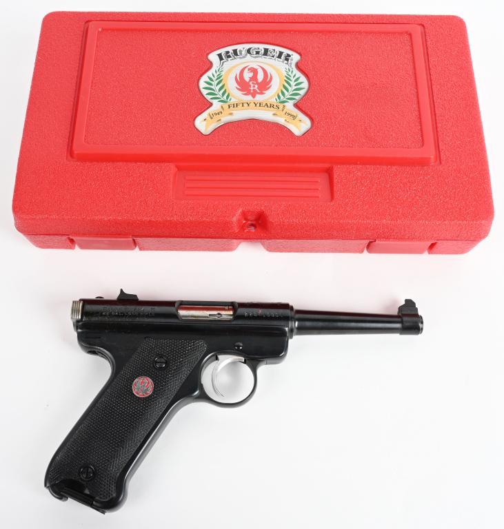 CASED RUGER 1949-1999 MARK II SEMI- AUTO PISTOL: SERIAL 223-16901. BARREL 4 3/4". CALIBER .22 LONG RIFLE. MADE IN 1999. These were made for 50 year anniversary of the Ruger .22 pistol with special red eagle black checkered grips and special logo on 