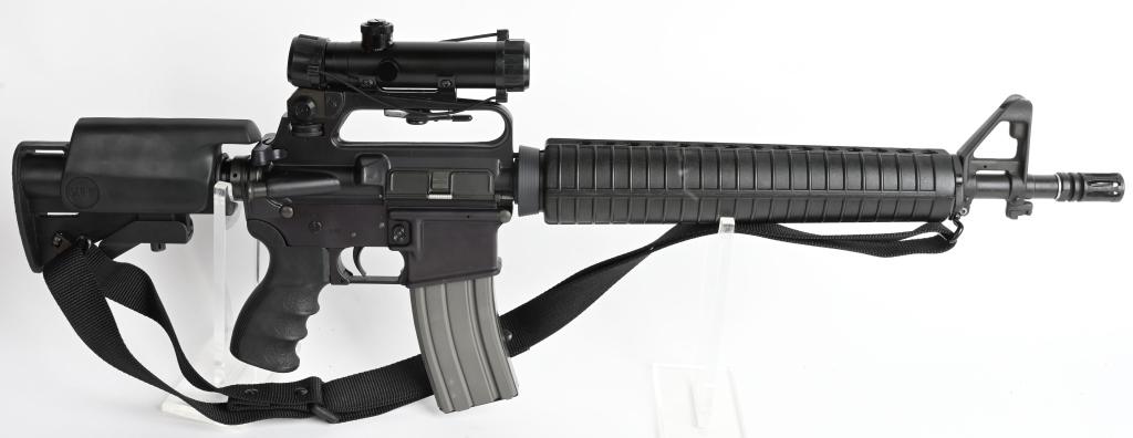 BUSHMASTER XM15-E2S .223-5.56 SEMI AUTO RIFLE: SERIAL: LO45998 BARREL: 16" CALIBER: 5.56mm / .223. Early 90's BFI Windham marked Bushmaster XM15-E2S short carbine. Features fixed carry handle, USGI style two-piece hand guards, flash suppressor, ba
