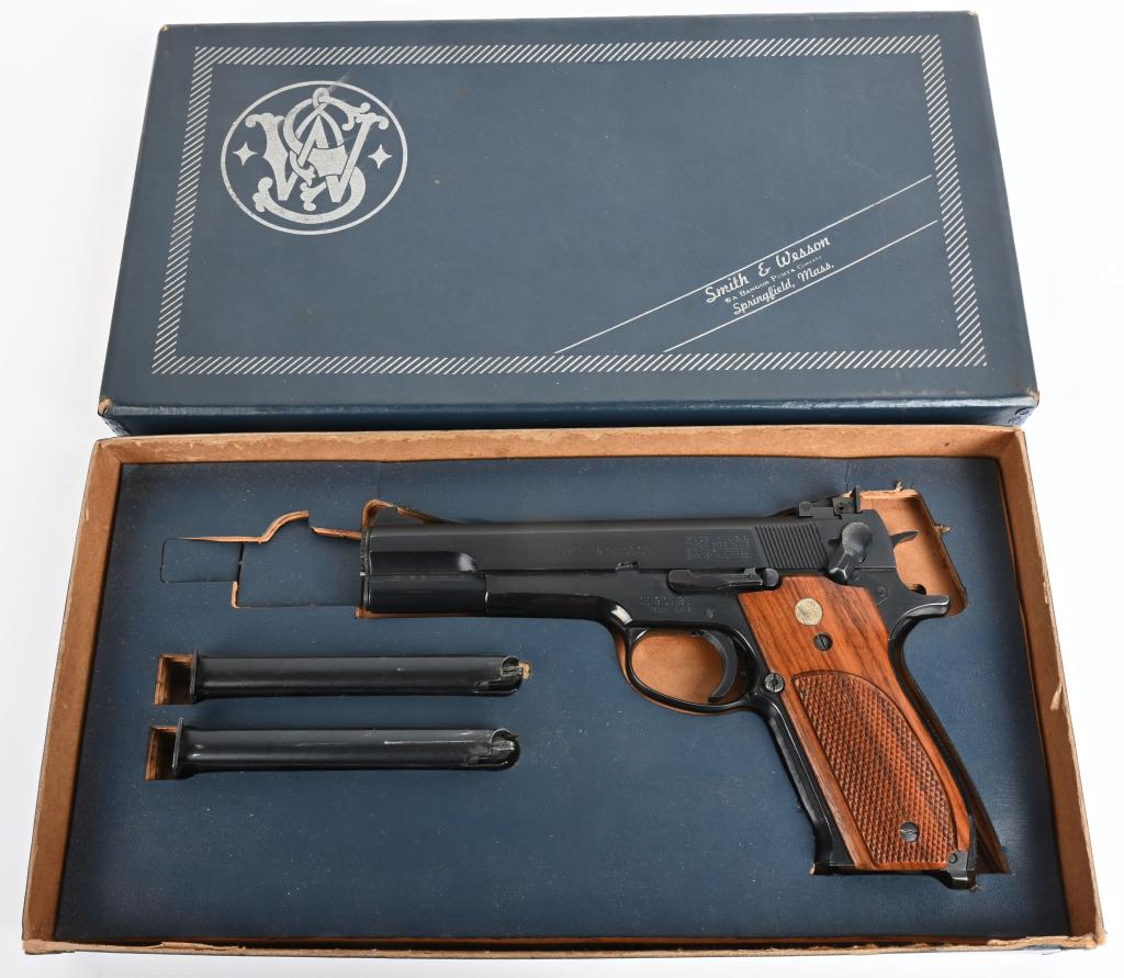 BOXED SMITH & WESSON MODEL 52-2 SEMI AUTO PISTOL: SERIAL A190131. BARREL 5". CALIBER .38 SPECIAL MID RANGE WAD CUTTER. MADE 1971-1993. The .38 Master single action semi automatic pistol. Shoots the .38 wad cutter only. Blue finish with checkered waln