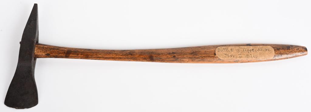 BATTLE OF TIPPECANOE RELIC AXE TAGGED: Old tag is adhered to the tomahawk handle. Provenance; sold at Cowan’s auction. Possibly a secondary tomahawk carried by a combatant. End of the wood inside of the tomahawk is deteriorating, as woul