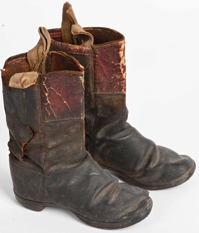 CIVIL WAR ERA CHILD's BOOTS: Scarce pair of Civil War era childs oots. Measure about 6" soles and 6 1/2" high. Heels afixed with cut square nails. The pair shows alot of wear, with scuffs and tears. Very Hard to find. Good