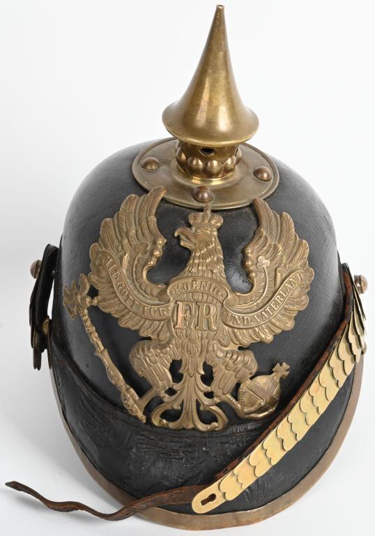 WW1 IMPERIAL GERMAN J.R. 53 PRUSSIAN SPIKE HELMET: Pre WWI Prussian NCO spiked helmet. Decent body and front and back visors. Cockades are missing, chin scales is partially missing but helmet plate is in excellent condition. Liner still retains nut is