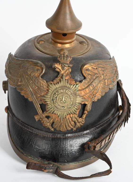 IMPERIAL GERMAN PRUSSIAN GUARD FUSILIER REGIMENT: Imperial German Prussian Guard Fusilier Regiment NCO Model 1895 Spiked Helmet. Measuring about 9-inches to the tip of the spike with polished leather skull and visors. All trim including the front vis