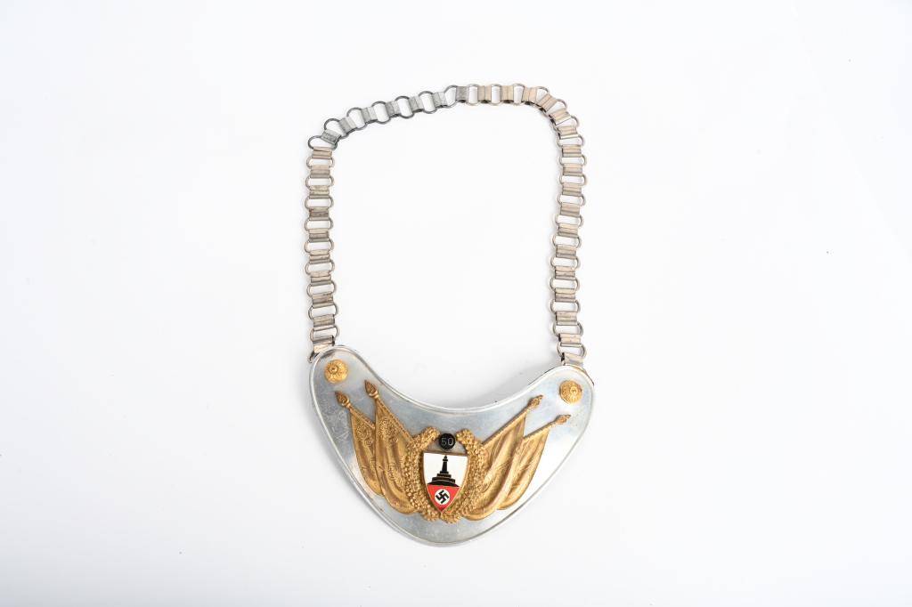 WWII NAZI GERMAN 50 DRKB FLAGBEARER'S GORGET WW2: Very nice early (circa 1937) multi-piece stamped polished natural aluminum construction heart shaped 50 gorget base with a separate fire gilted and multi-colored enamel work face plate. All complete a