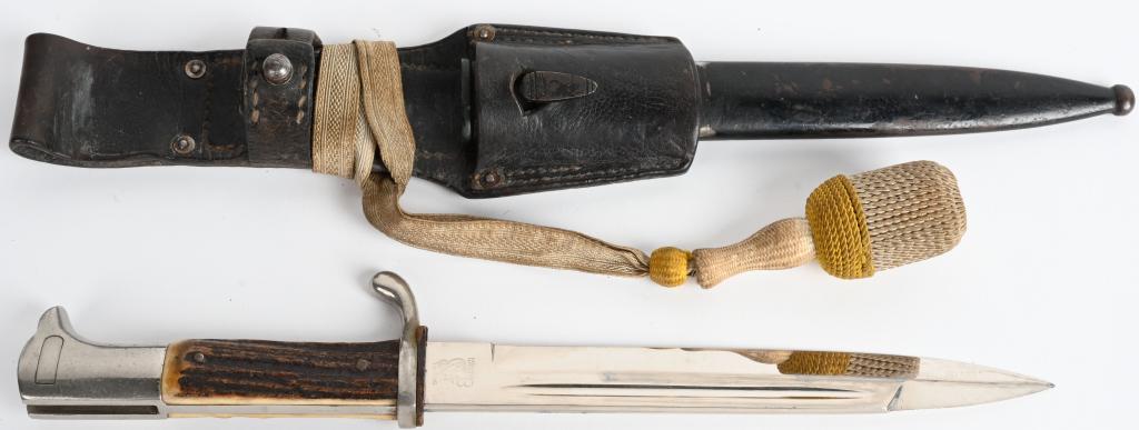 WWII NAZI GERMAN LUFTWAFFE DRESS BAYONET EICKHORN: Signed on the ricasso with Eickhorn sqirrel mark. Features stag grips, and comes with white and yellow bayonet knot / porteppe in original scabbard with leather frog. Frog has a letter "L" stamped on 
