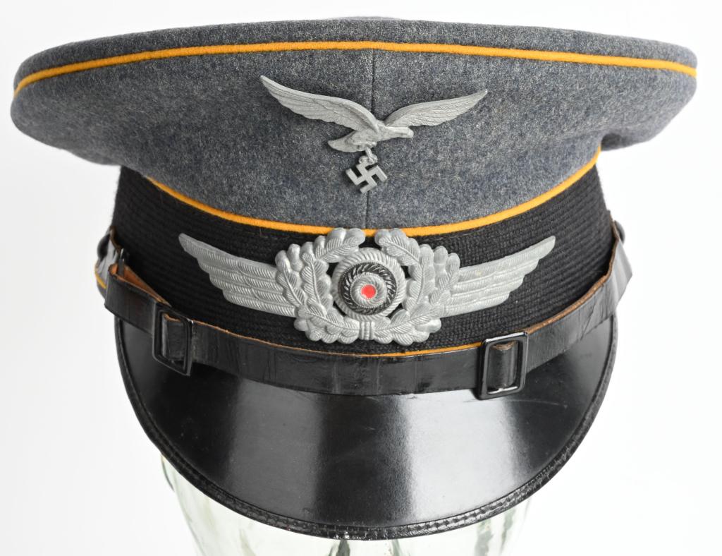 WWII NAZI GERMAN LUFTWAFFE FLIGHT VISOR HAT WW2: Nice quality, issued, Luftwaffe blue/gray, wool/tricot blend construction visor cap, features a black, horizontally ribbed, interwoven, mohair centerband, and golden yellow wool waffenfarbe piping to