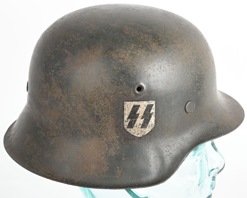 WWII NAZI GERMAN WAFFEN SS M42 SD HELMET CKL64 WW2: The stamped sheet steel construction helmet retains most of its original field-gray paint. The right side of the helmet has a second pattern, "SS" runic decal with black runes on a silver shield shape