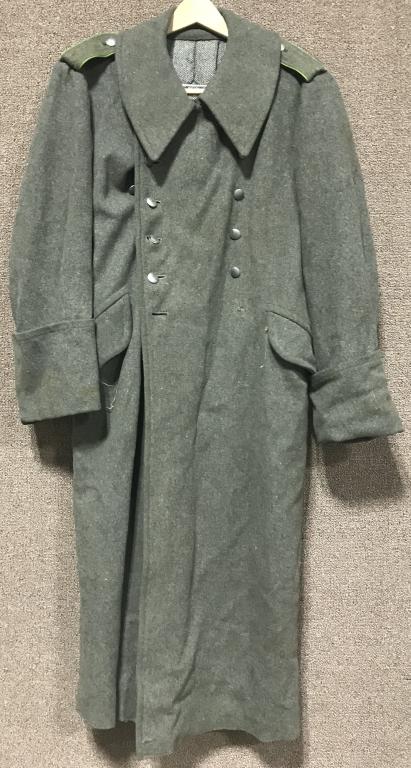 WWII NAZI GERMAN PANZER GRENADIER M40 GREATCOAT: Issued, heavy, post-1940 pattern, field-gray wool blend construction, double breasted style, full length, greatcoat with a field-grey wool blend lay down collar. The greatcoat features dual, vertical,