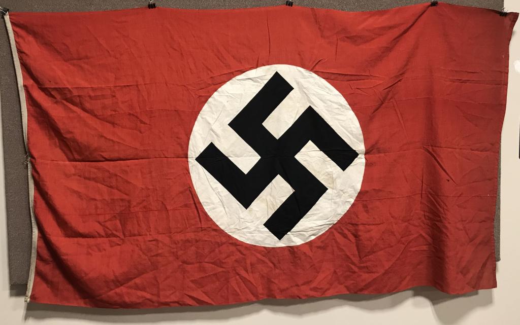 WWII NAZI GERMAN NSDAP WALL BANNER WW2: Multi-piece wool construction banner approximately 56 X 98 inches. To both its red fields are sewn white disks, with a applied mobile swastikas in black. Minor holes but otherwise Excellent. Probably 