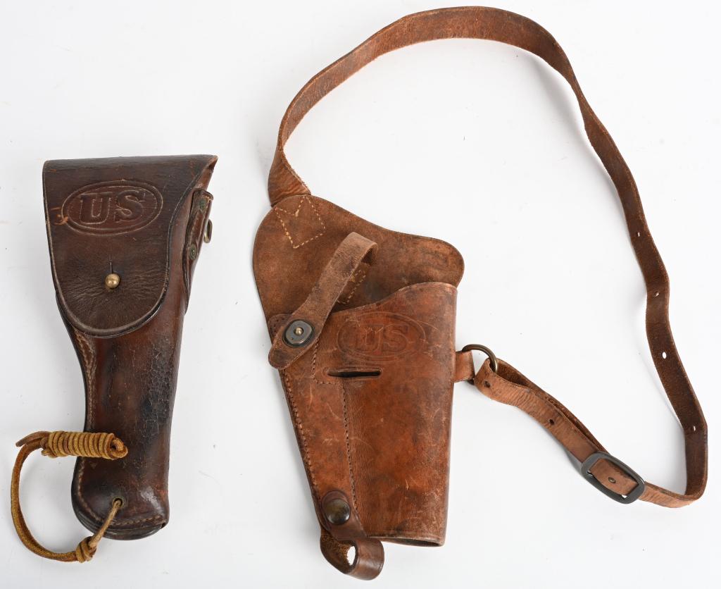 WWI + WWII US 1911 + M1911A1 PISTOL HOLSTERS: WWI + WWII US 1911 + M1911A1 PISTOL HOLSTERSPair of brown leather US embossed military holsters. First one is dated 1917 and the second is an "Enger Kress" open top shoulder holster with leather str