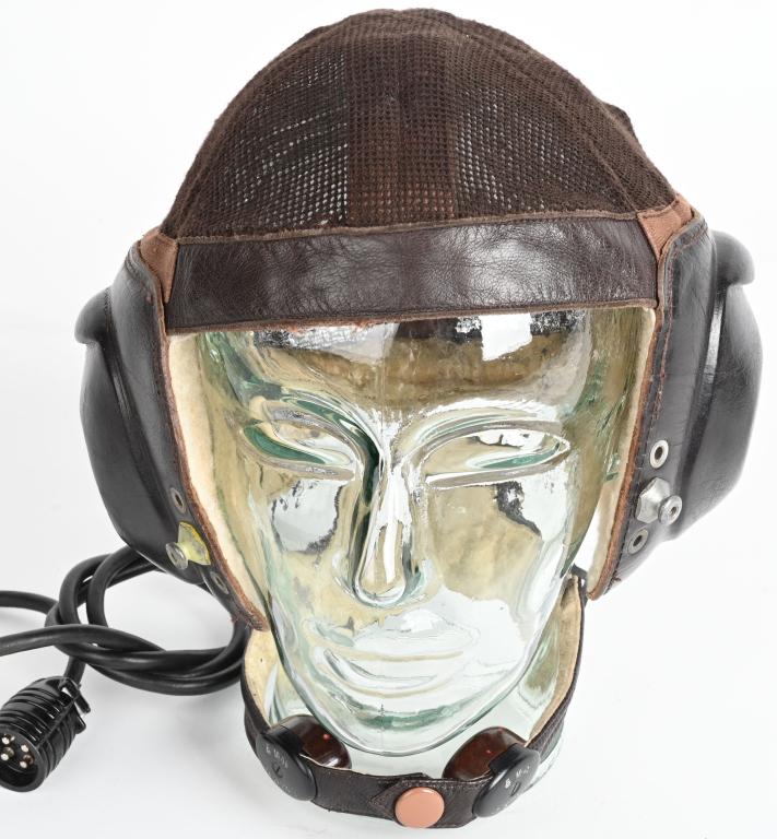 WWII NAZI GERMAN LKPN101 SUMMER FLIGHT HELMET WW2: Early pattern, brown cotton mesh net construction flight helmet with brown leather fittings and Bakelite communications equipment. The helmet features a fine cotton mesh net to the crown and back with