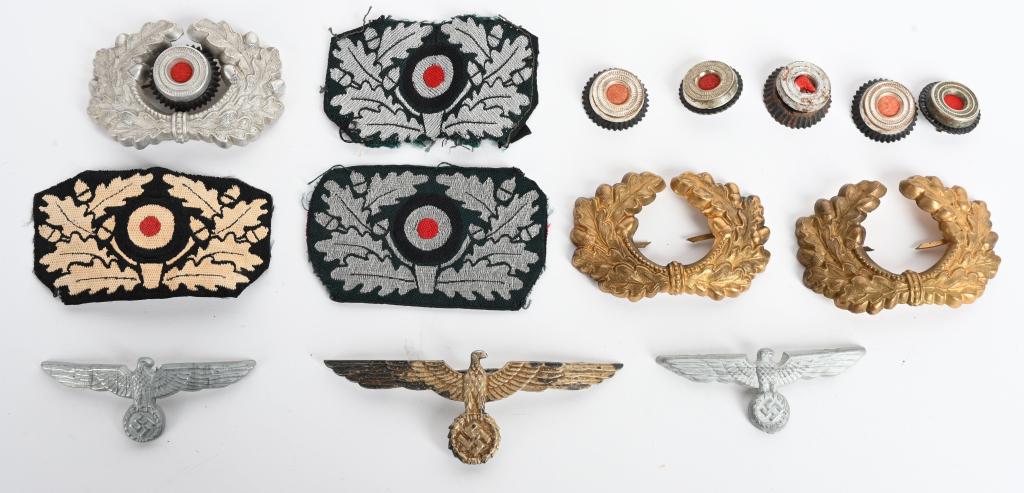 WWII NAZI GERMAN INSIGNIA LOT KM HEER PANZER WW2: WWII Nazi German insignia to include 1) WWII German Nazi Panzer Beret Wreath & Cockade Taken From Album. Early pattern, (circa 1934-1939), insignia consists of a machine woven, black rayon base featur