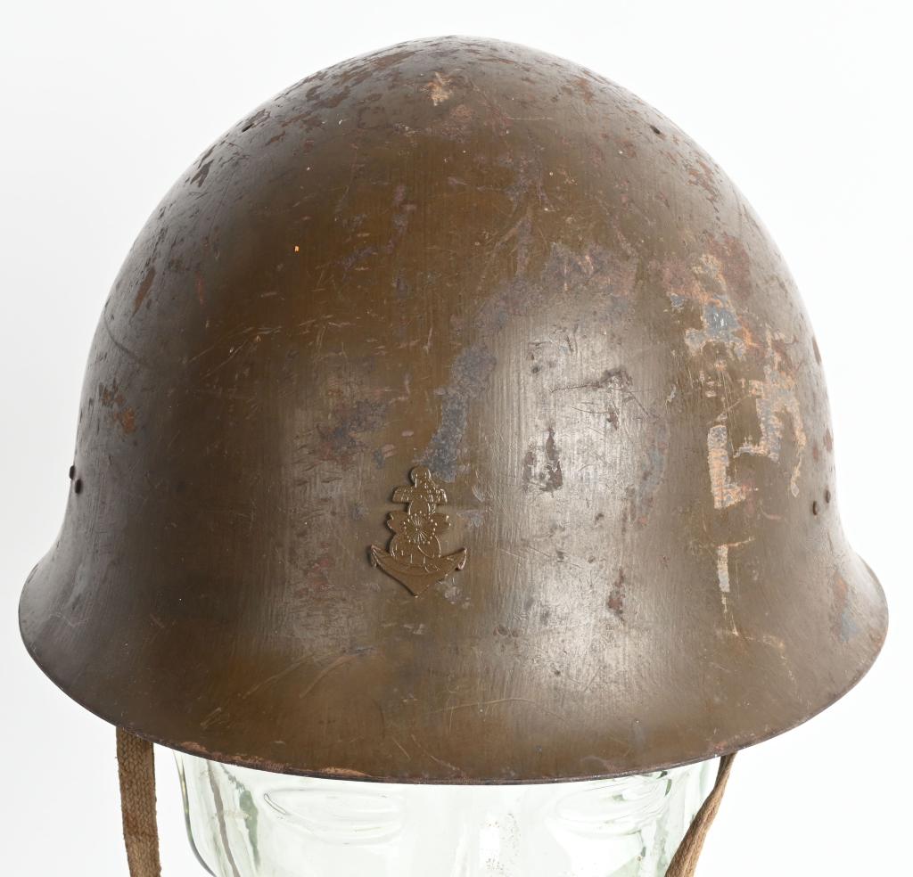 WWII IJN TYPE 90 COMBAT HELMET WITH LINER WW2 NAVY: The standard WWII Japanese infantry combat helmet. The shell, constructed from chrome polybend steel retains a good portion of its original paint. The original IJN metal Anchor affixed to the front. T
