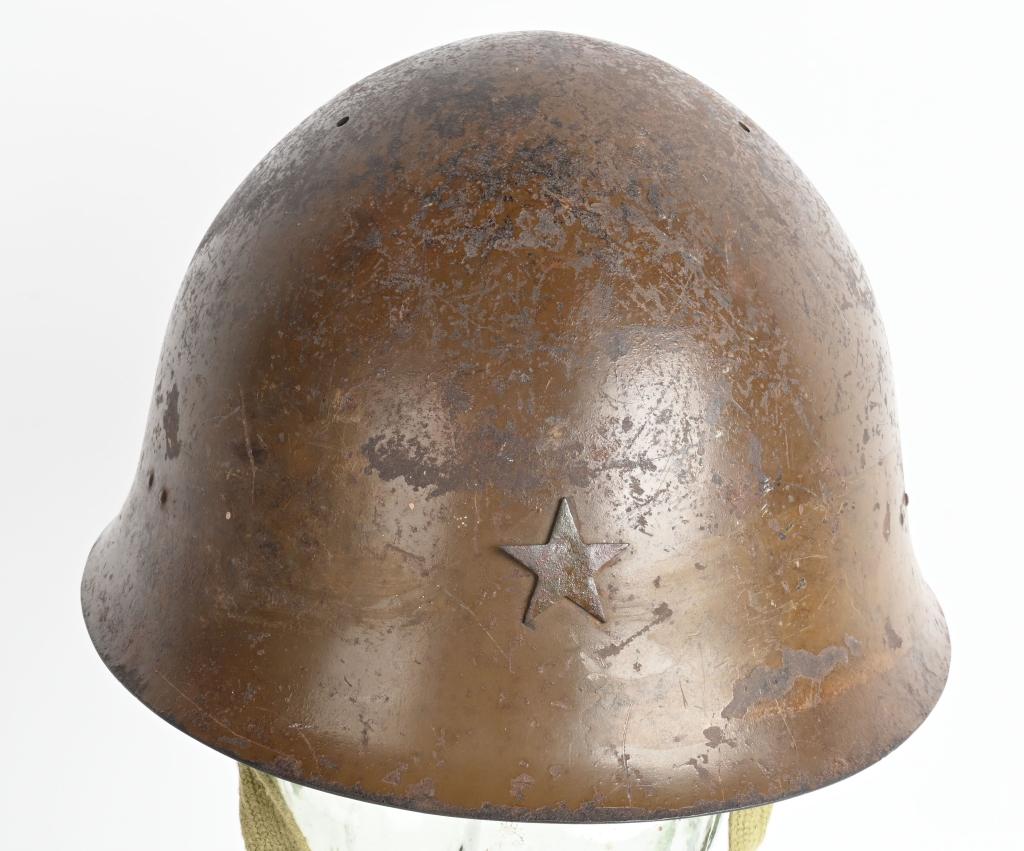 WWII IJA TYPE 90 COMBAT HELMET WITH LINER WW2: The standard WWII Japanese infantry combat helmet. The shell, constructed from chrome polybend steel retains a good portion of its original paint. The original IJA metal star affixed to the front. The