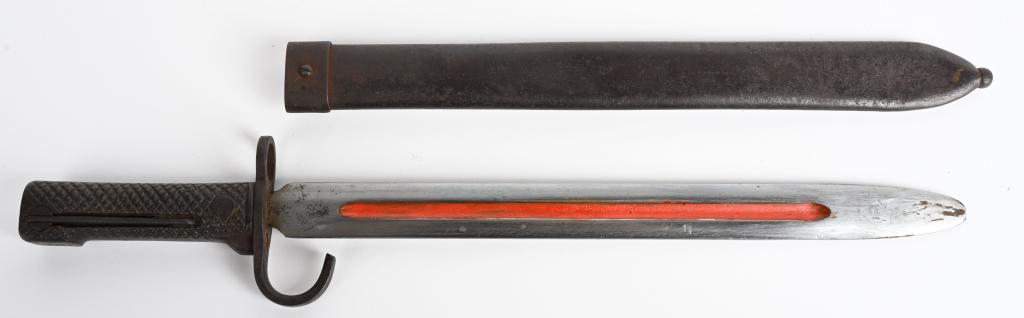 WWII JAPANESE CHILDS TRAINING BAYONET W/ SCABBARD: WWII Japanese metal handled child's training bayonet that has never been sharpened with a single blood groove to the center that has factory red paint. Its 11 and 1/8 inch blade is in excellent condit