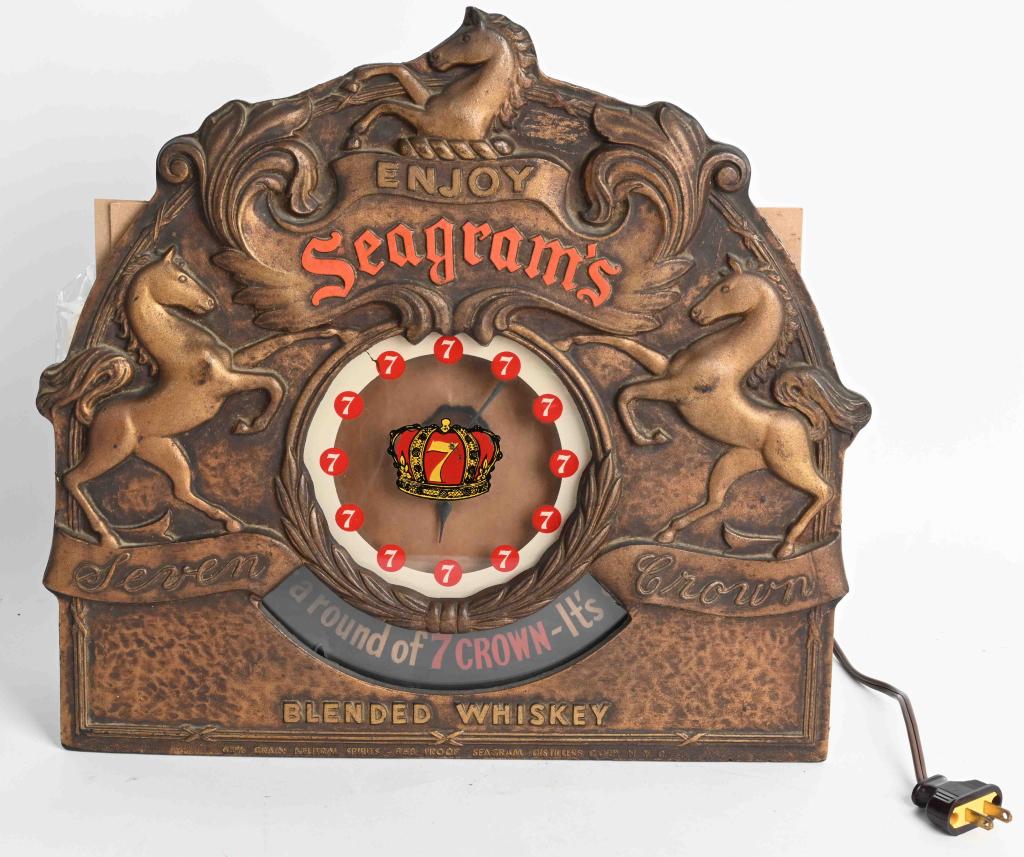 SEAGRAM'S LIGHT-UP REVOLVING CLOCK: Seagram's Whiskey Light-Up Revolving Clock. Lighted up and worked when tested. Can be hung or sat on shelf 16" Excellent