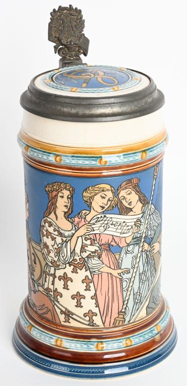 METTLACH #2581 .5L WOMEN PLAYING HARPS STEIN: Mettlach #2581 half liter Stein. Has Women Playing Harps. Has tight hairine on top. Very hard to see unless looking for it. 9" Very Good-Excellent