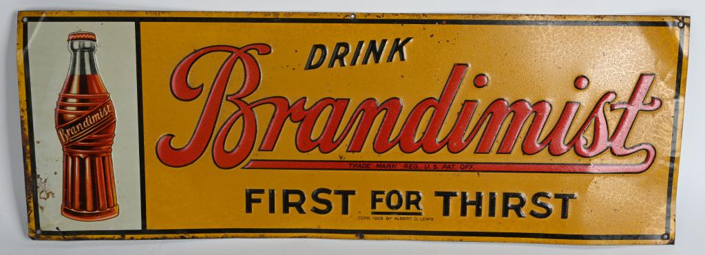 1928 BRANDIMIST DRINK EMBOSSED TIN SIGN: Brandimist Drink embossed tin sign. Marked Corp 1928 By Albert D Lewis. Has some edge wear. 27 1/2" Very Good-Excellent