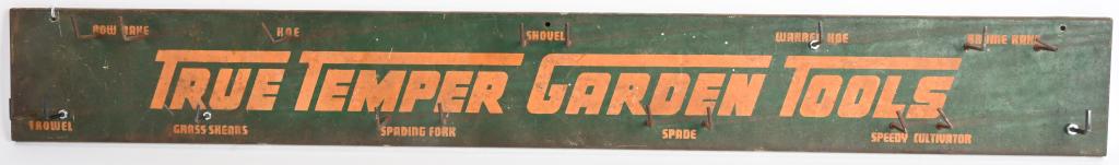 TRUE TEMPER GARDEN TOOLS STORE DISPLAY TIN SIGN: Original True Temper Garden Tools Store Display with tin Sign. All original with patina. Still has holders for tools. 48"x6" Very Good