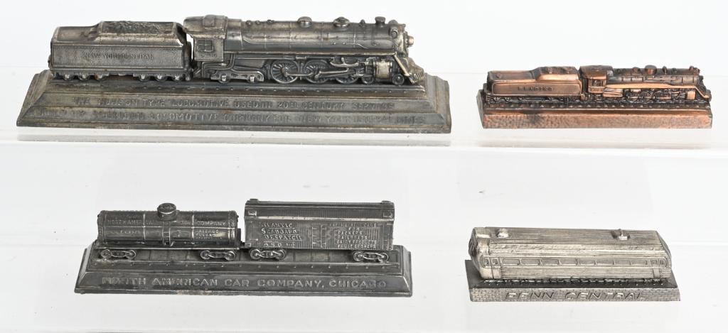 4- VINTAGE RAILROAD PAPERWEIGHTS: Including Reading Railway System, North American Car Company, American Locomotive, and Penn Central. Largest 9 1/2" Excellent